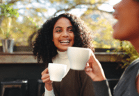 woman smiling with coffee
