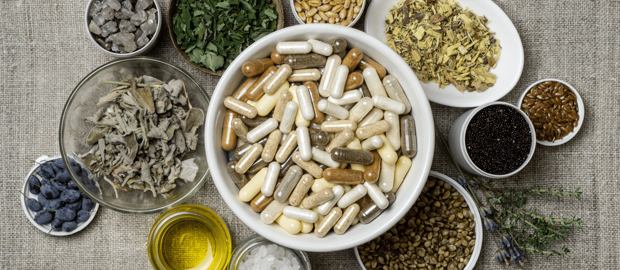 bowls of herbs, crystals, and medication supplements